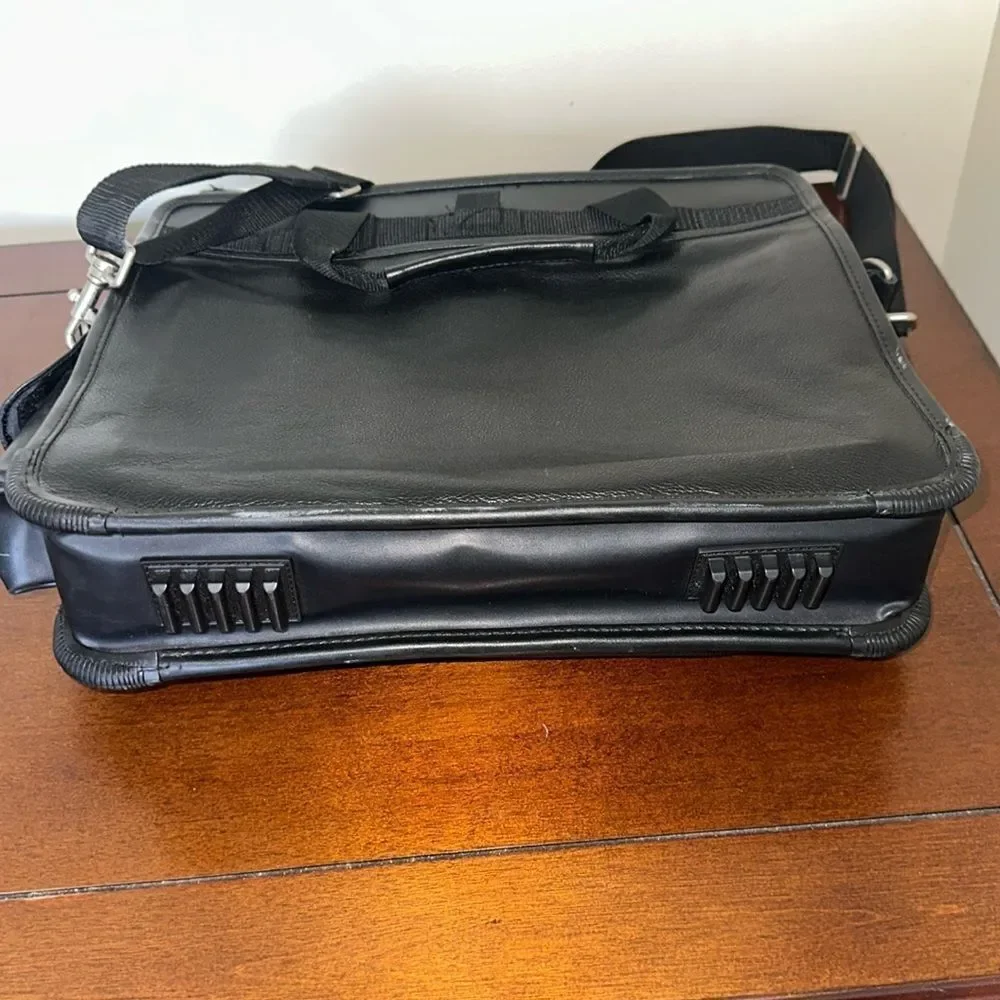 TARGUS Black Tech Padded Faux Leather Laptop Travel Bag with a Crossbody Strap
